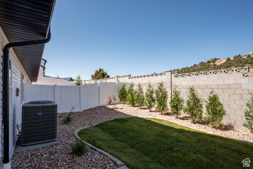 View of yard featuring central air condition unit