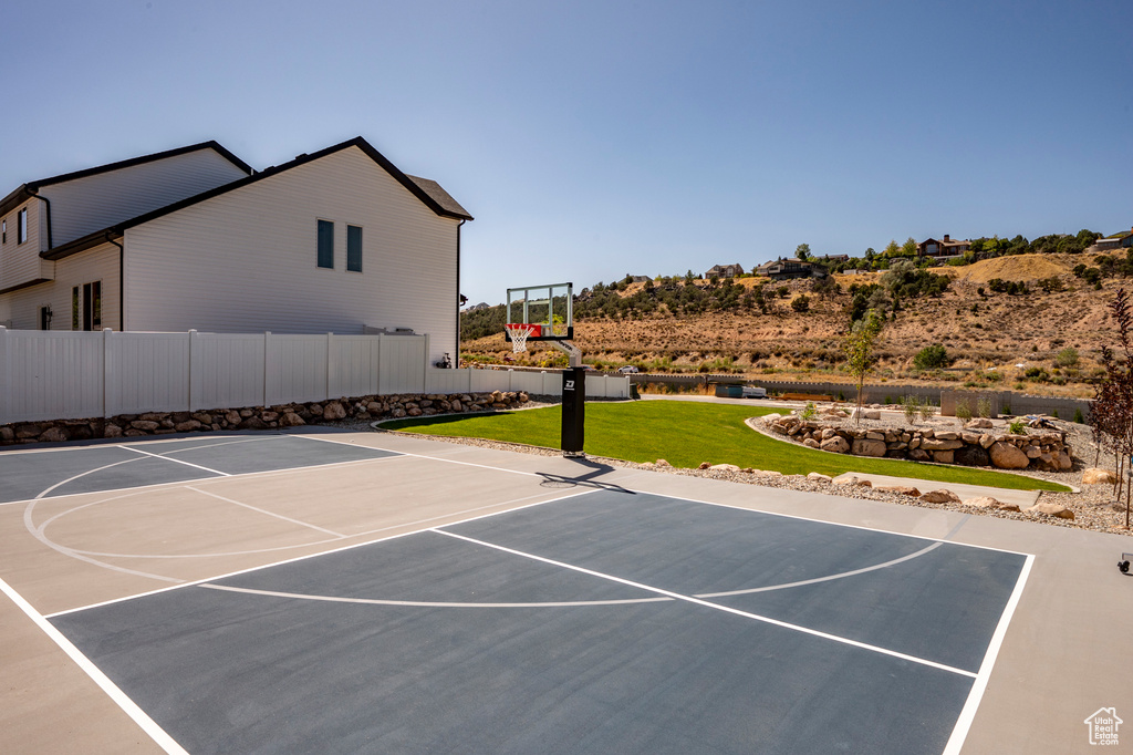 View of basketball court featuring basketball hoop