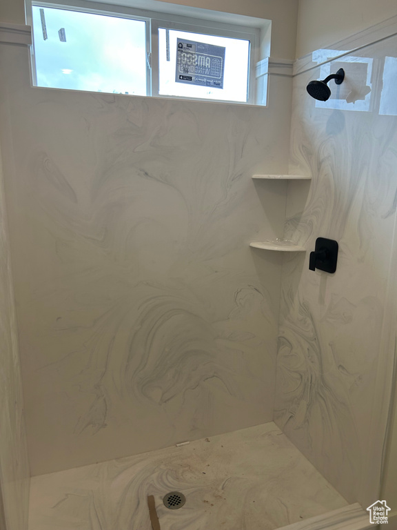 Bathroom with a marble finish shower