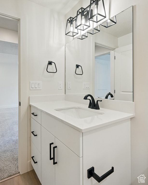 Bathroom with vanity and wood finished floors