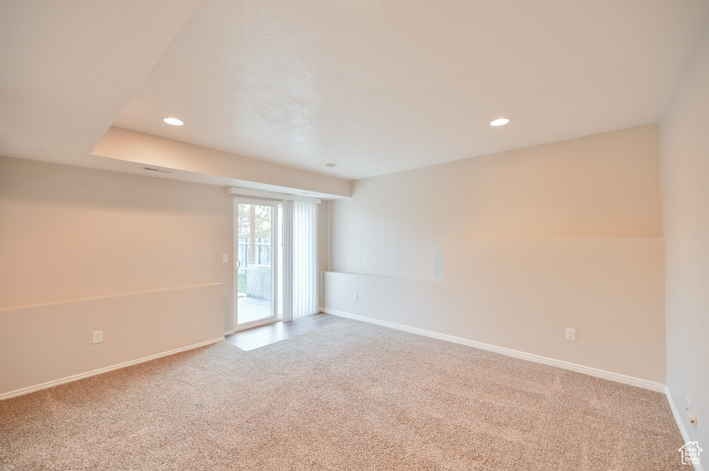 Spare room with carpet, baseboards, and recessed lighting