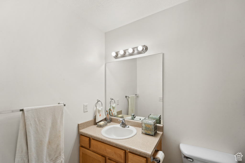 Bathroom featuring toilet and vanity