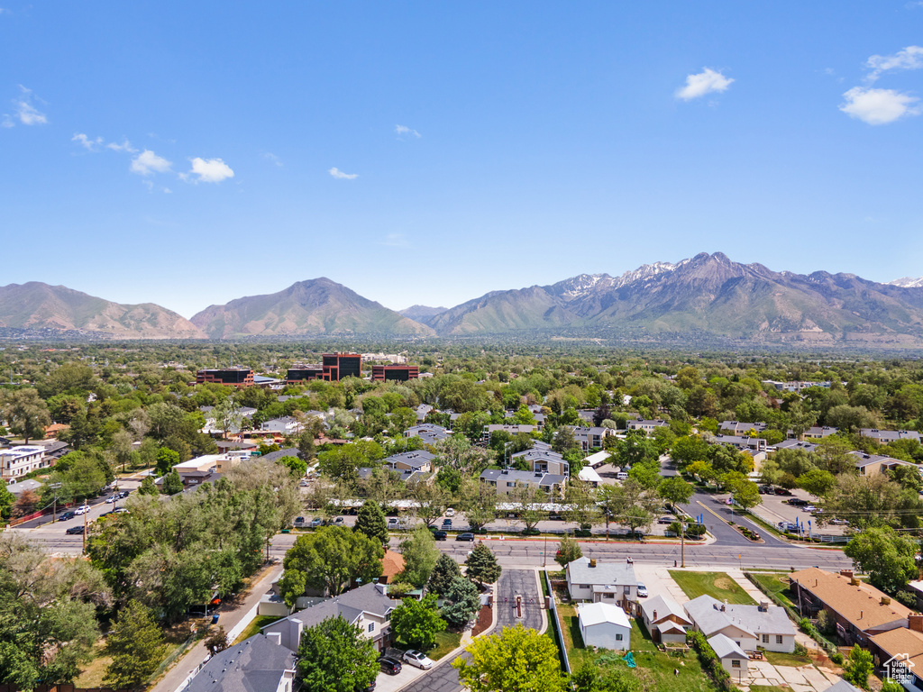 Aerial perspective of suburban area featuring a mountainous background
