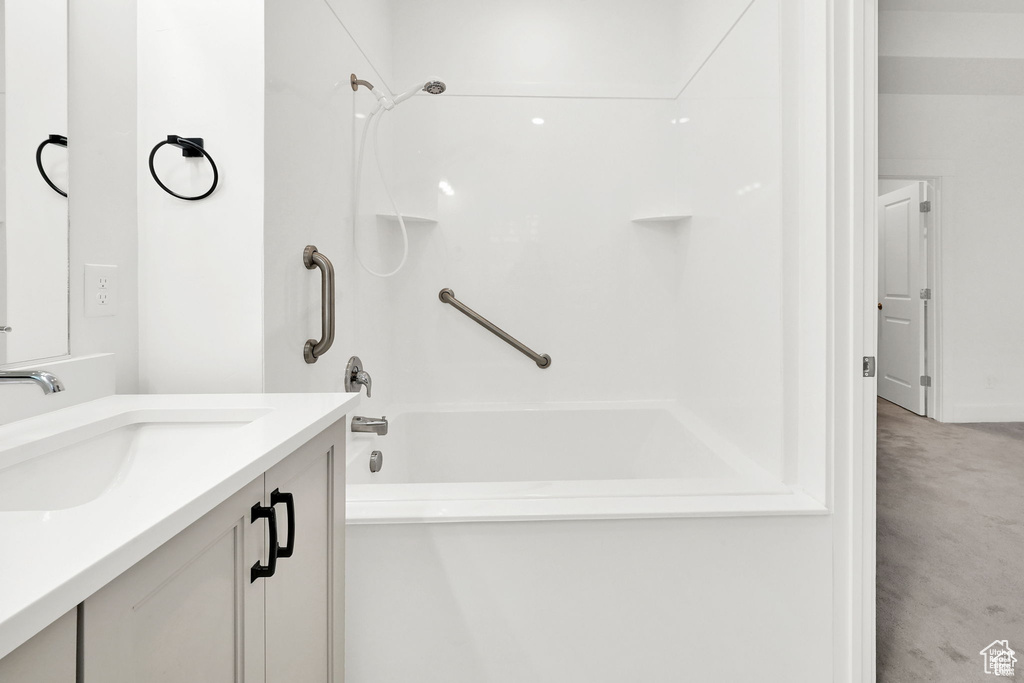 Full bathroom with shower / washtub combination and vanity