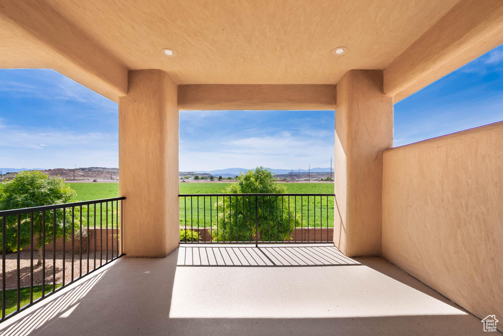 Balcony featuring a mountain view and a rural view