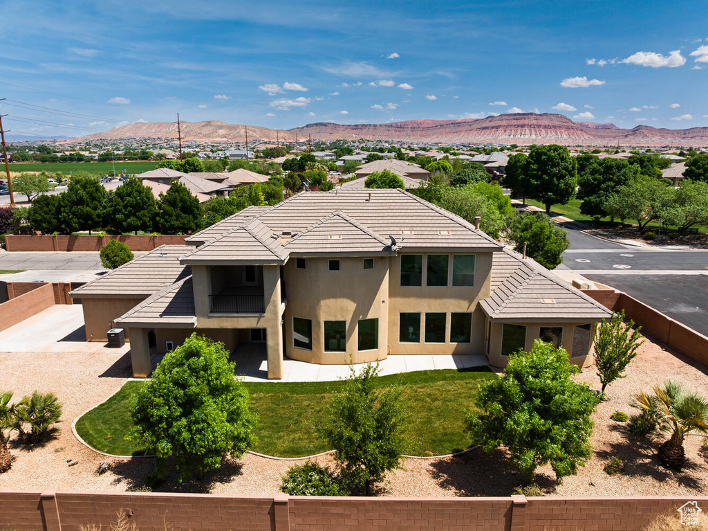 View of subject property featuring a mountain backdrop