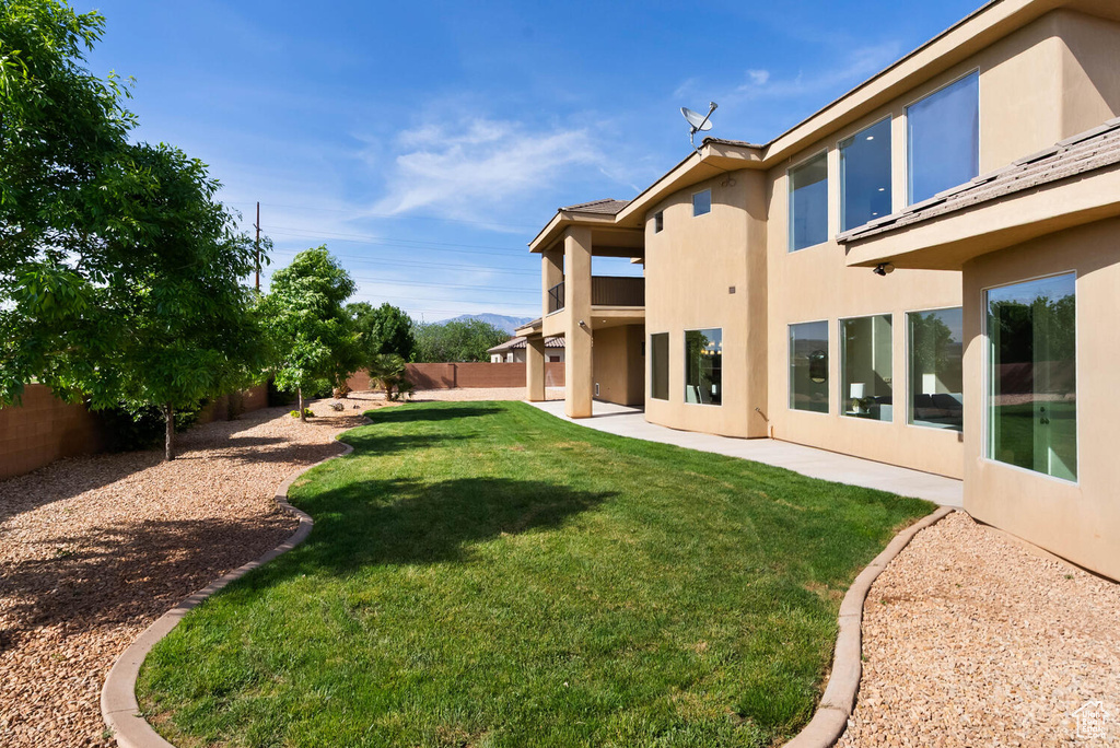 View of yard with a patio
