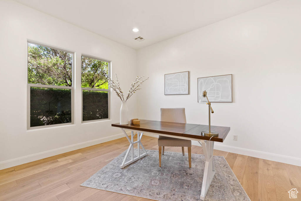 Office area with baseboards, light wood-type flooring, and recessed lighting