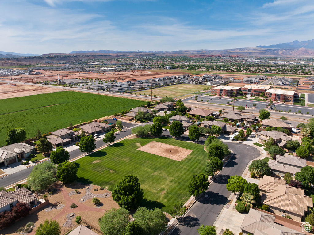 Aerial perspective of suburban area with a mountain backdrop