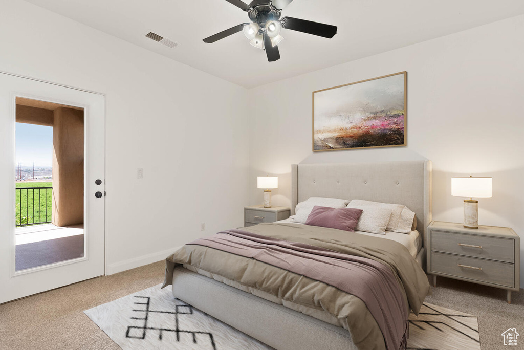 Bedroom with carpet, access to exterior, a ceiling fan, and baseboards