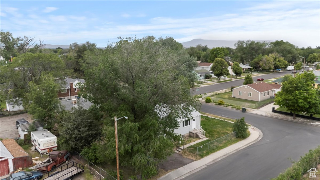 Aerial perspective of suburban area featuring a mountain backdrop
