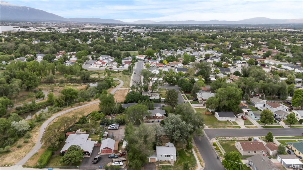 View of property location with a mountainous background and nearby suburban area