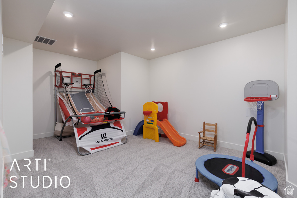 Playroom with carpet floors, recessed lighting, and visible vents
