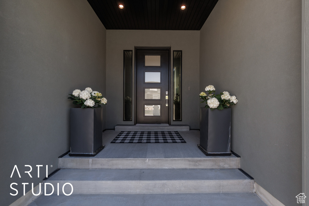Property entrance with stucco siding