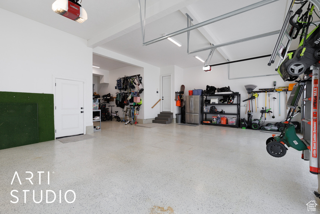 Garage featuring a garage door opener