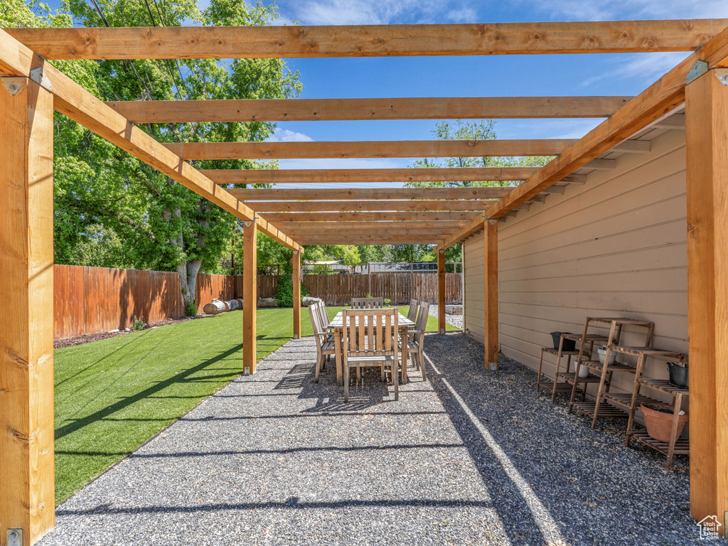 View of patio / terrace featuring a pergola and outdoor dining area