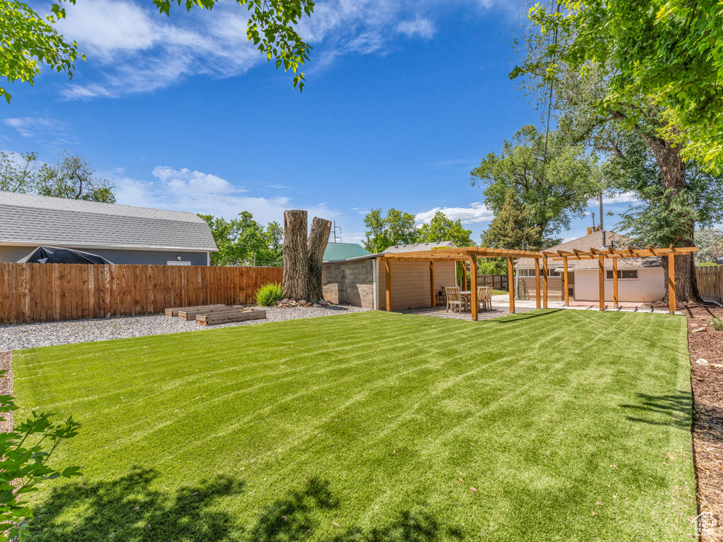 View of yard featuring a pergola and a patio