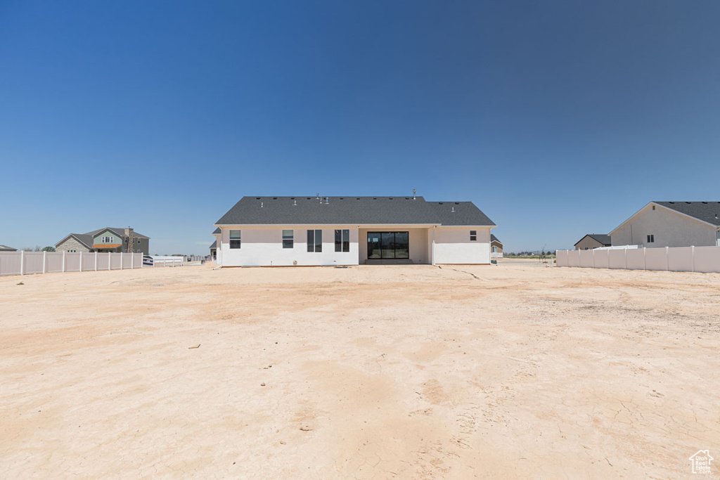 Rear view of property with fence