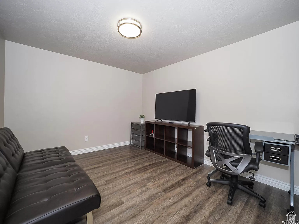 Office area featuring wood finished floors and baseboards
