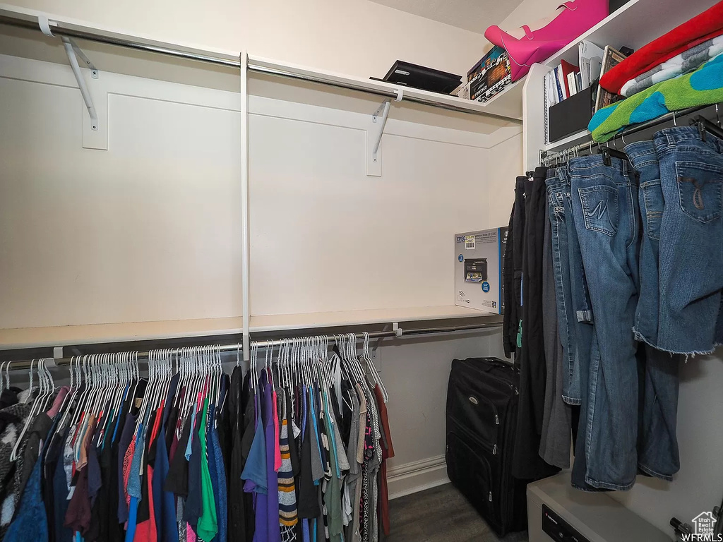 Spacious closet with wood finished floors