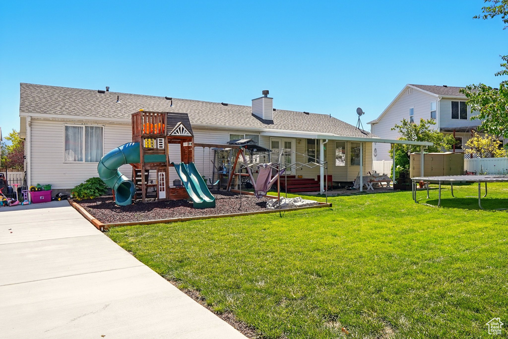 View of jungle gym with a trampoline