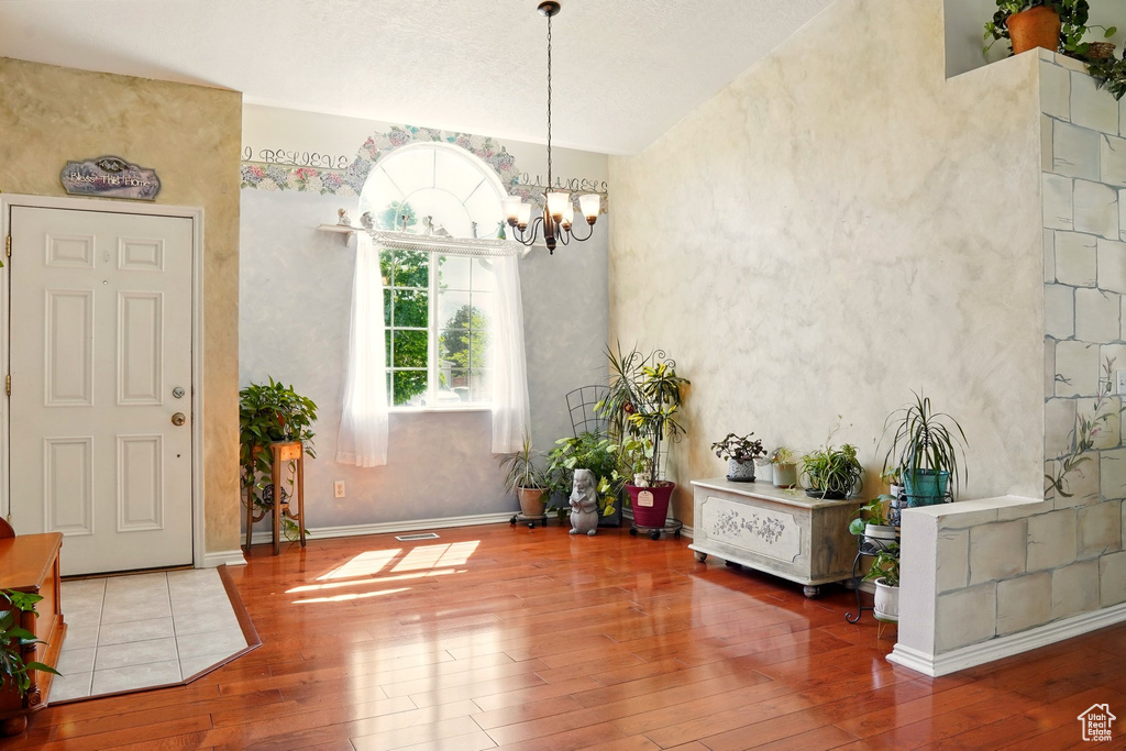 Dining space featuring hardwood / wood-style floors and a chandelier