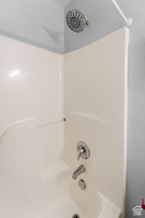 Full bath featuring shower / washtub combination