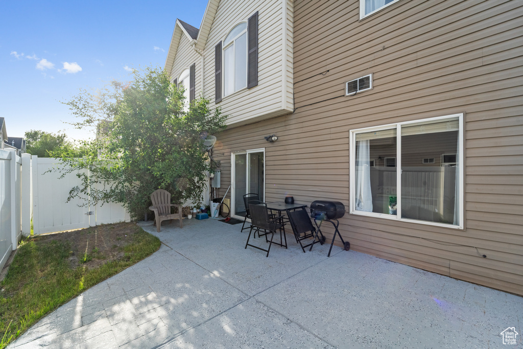 View of patio / terrace featuring a fenced backyard and a grill