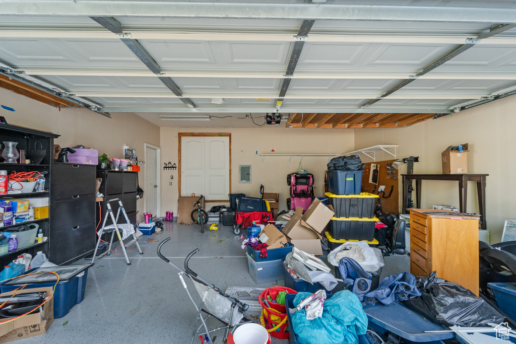Garage with a garage door opener and electric panel
