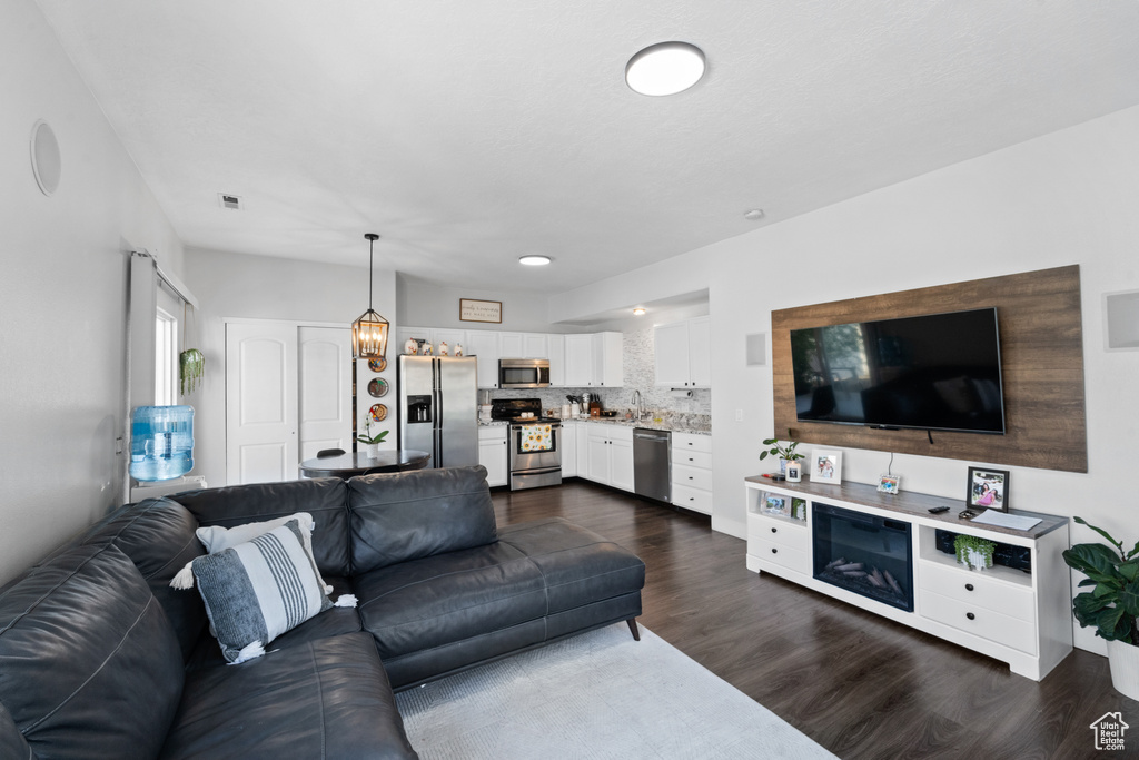 Living room featuring dark wood-type flooring