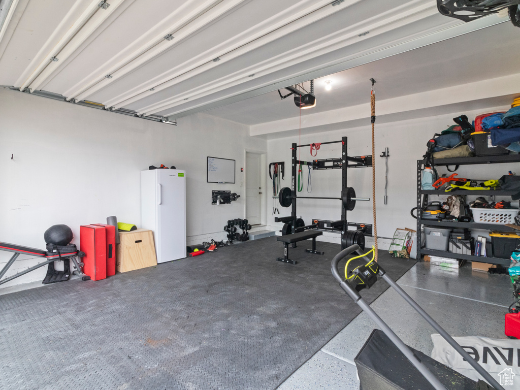 Garage featuring a garage door opener