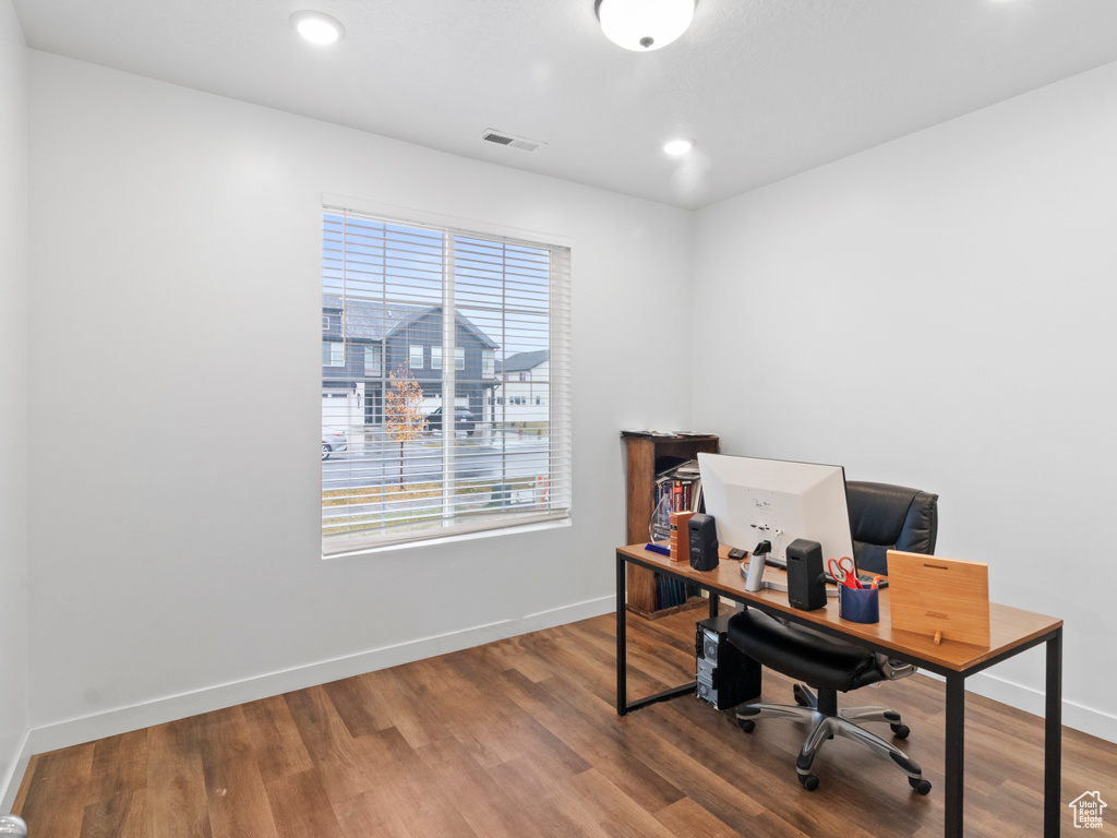 Home office with wood finished floors, baseboards, and recessed lighting