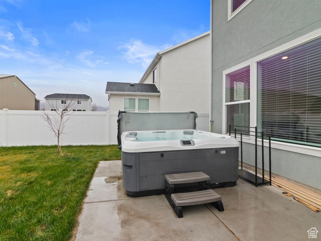 View of patio / terrace with a hot tub
