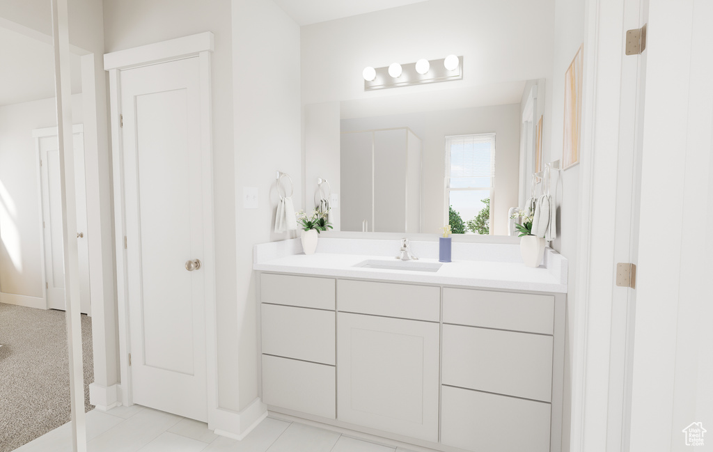 Bathroom featuring vanity and baseboards