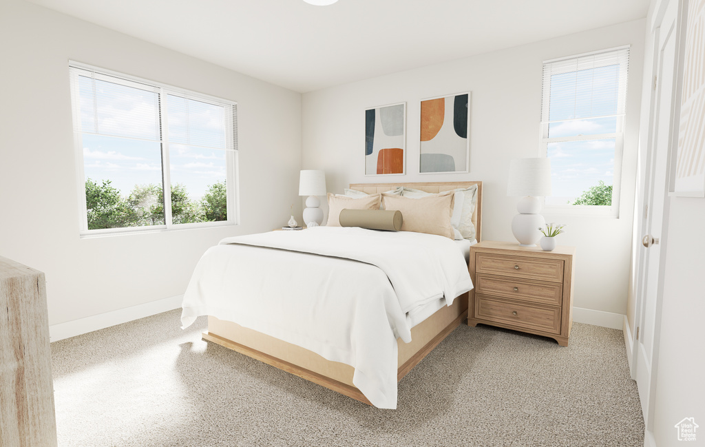 Bedroom with baseboards and light carpet