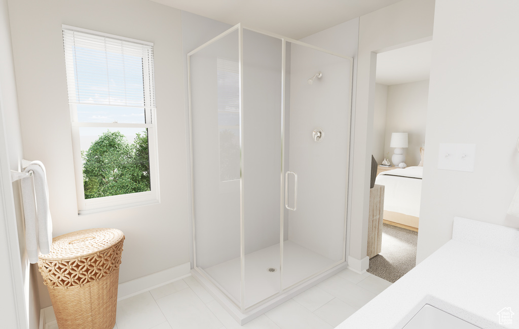 Bathroom with a shower stall, baseboards, and connected bathroom