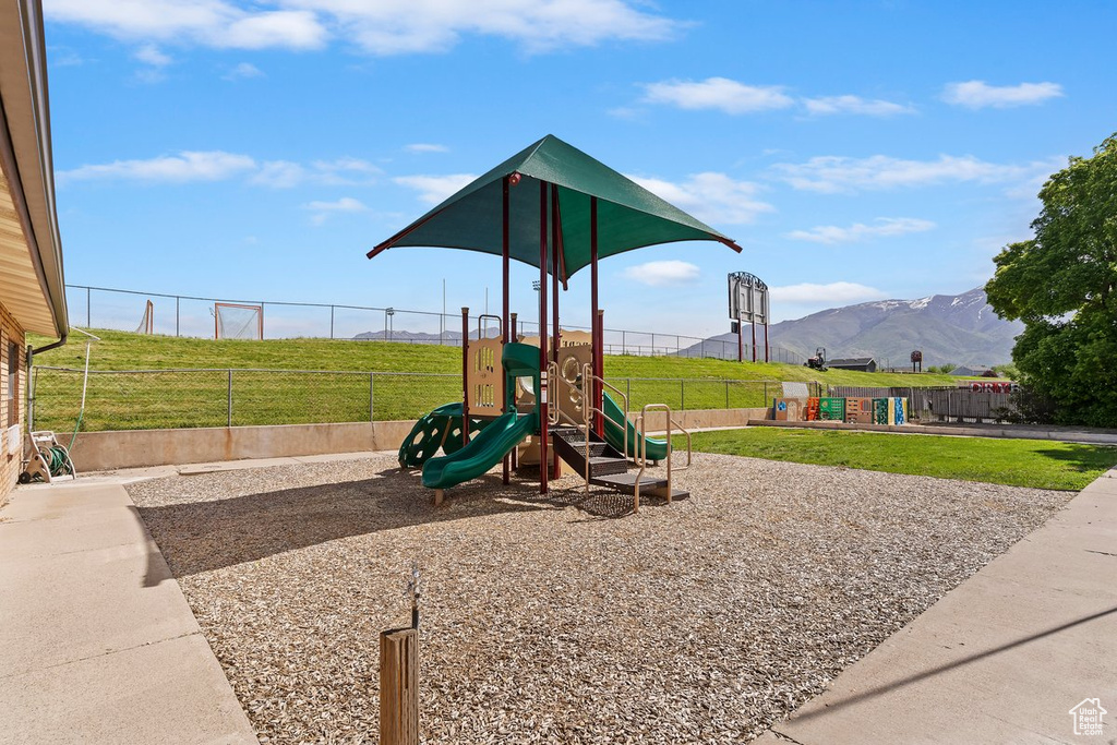 Community playground featuring a mountain view