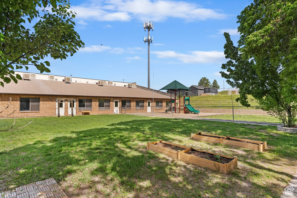 Rear view of house featuring brick siding