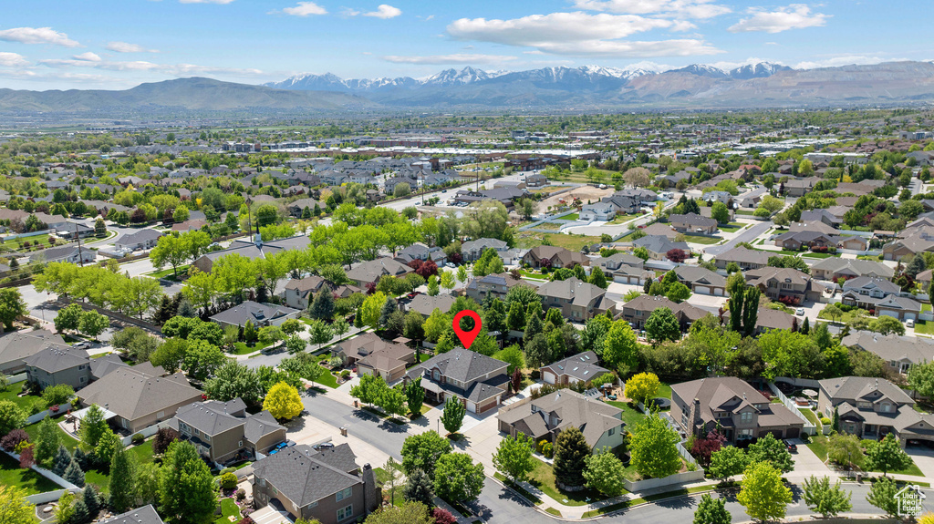 Aerial perspective of suburban area with a mountain backdrop