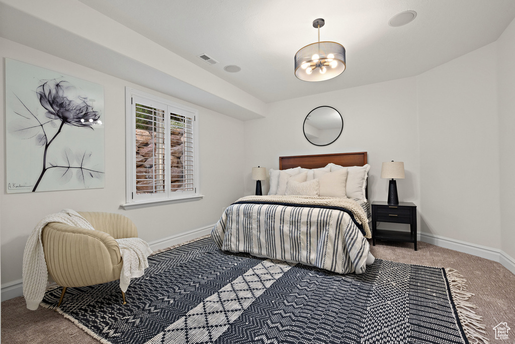 Bedroom with carpet and baseboards