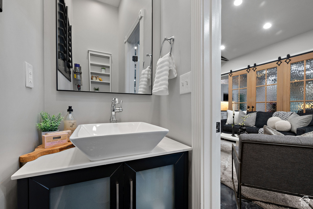 Bathroom with recessed lighting and vanity