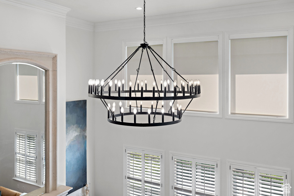 Detailed view of a chandelier and ornamental molding
