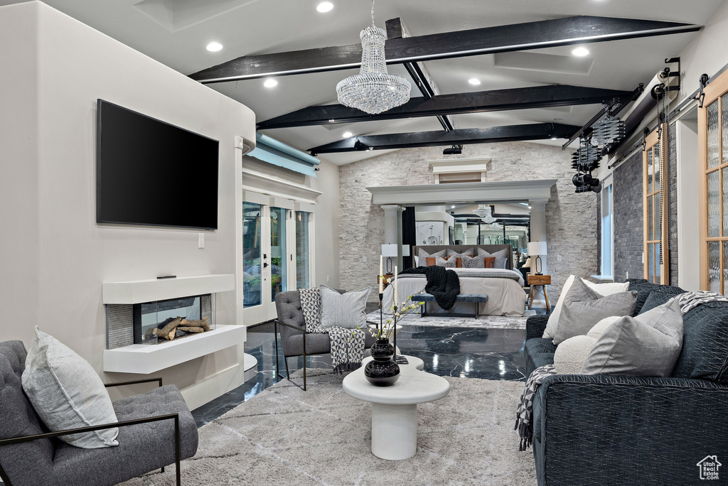 Living room featuring a barn door and recessed lighting