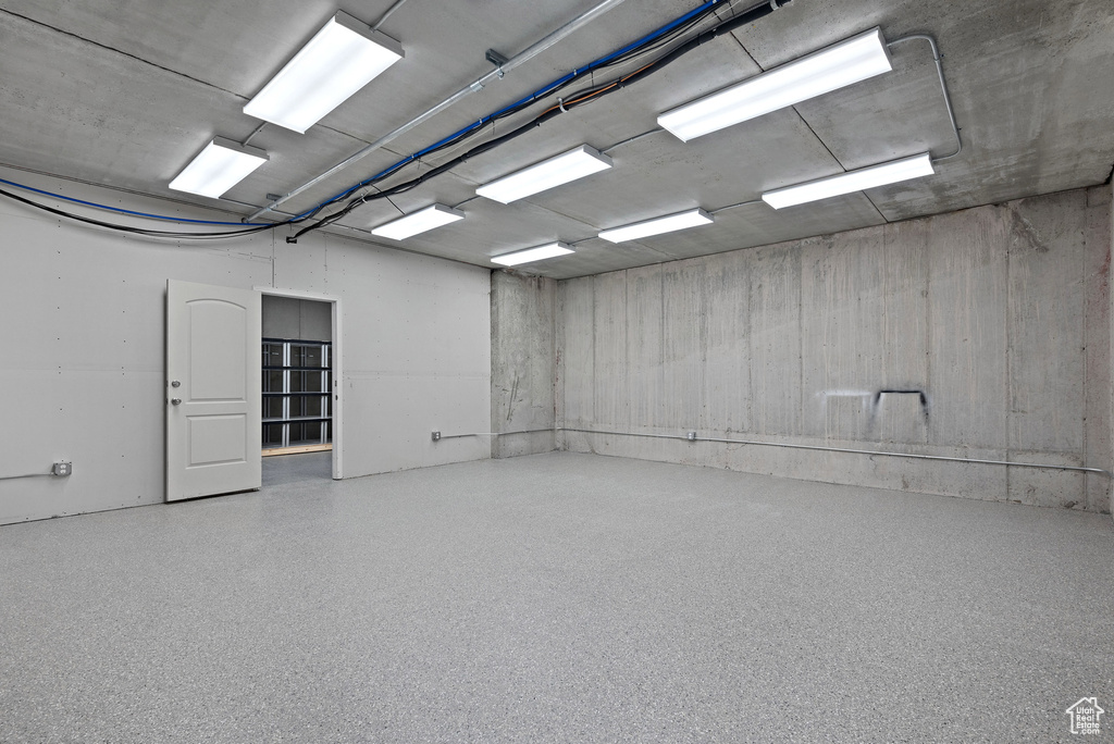 Spare room featuring speckle patterned floor