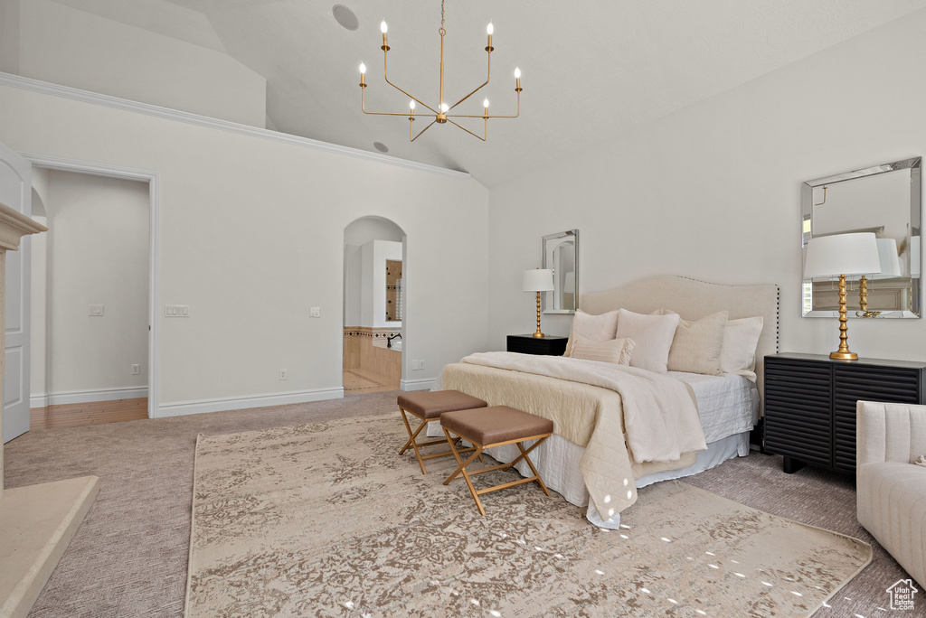 Bedroom featuring arched walkways, high vaulted ceiling, a chandelier, carpet, and baseboards