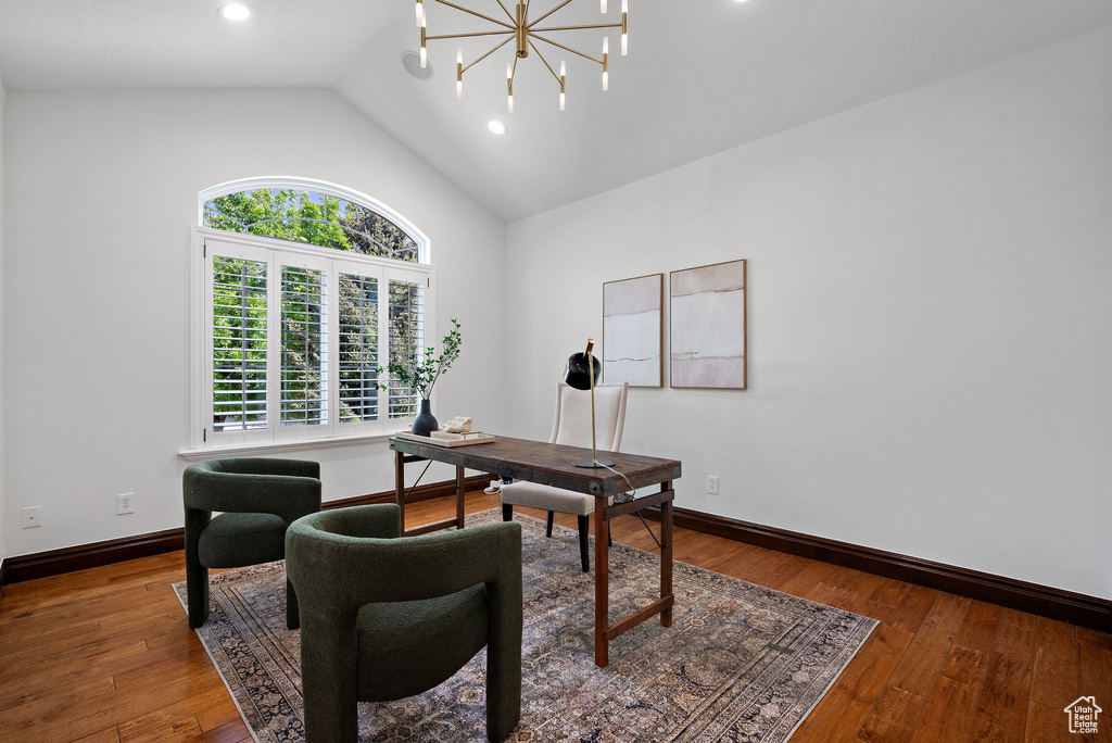 Home office featuring vaulted ceiling, baseboards, wood finished floors, and recessed lighting