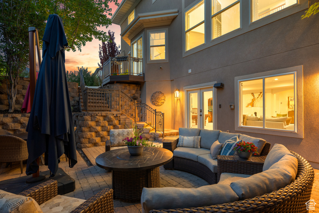 View of patio / terrace featuring stairway, french doors, and an outdoor hangout area