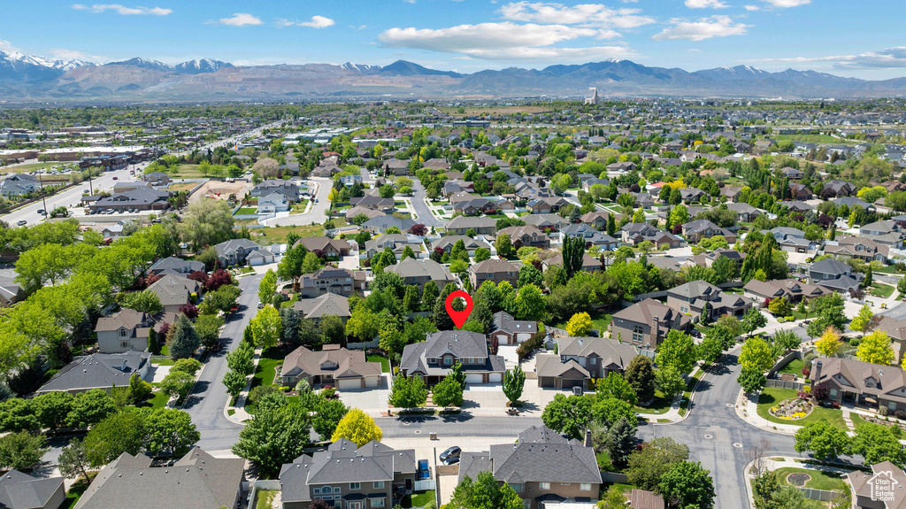 Aerial perspective of suburban area featuring a mountainous background