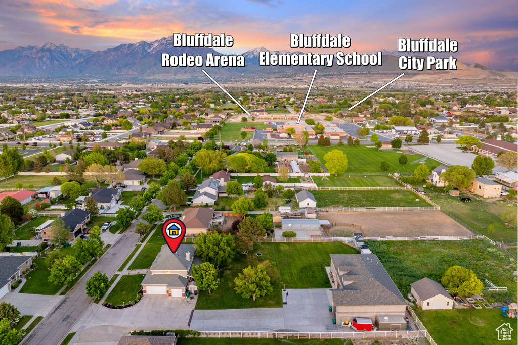 Aerial perspective of suburban area with a mountainous background