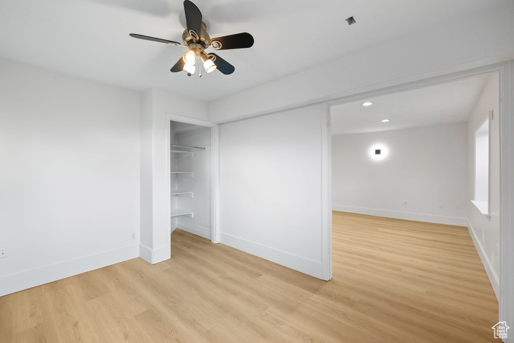 Unfurnished bedroom featuring baseboards, light wood finished floors, recessed lighting, and ceiling fan